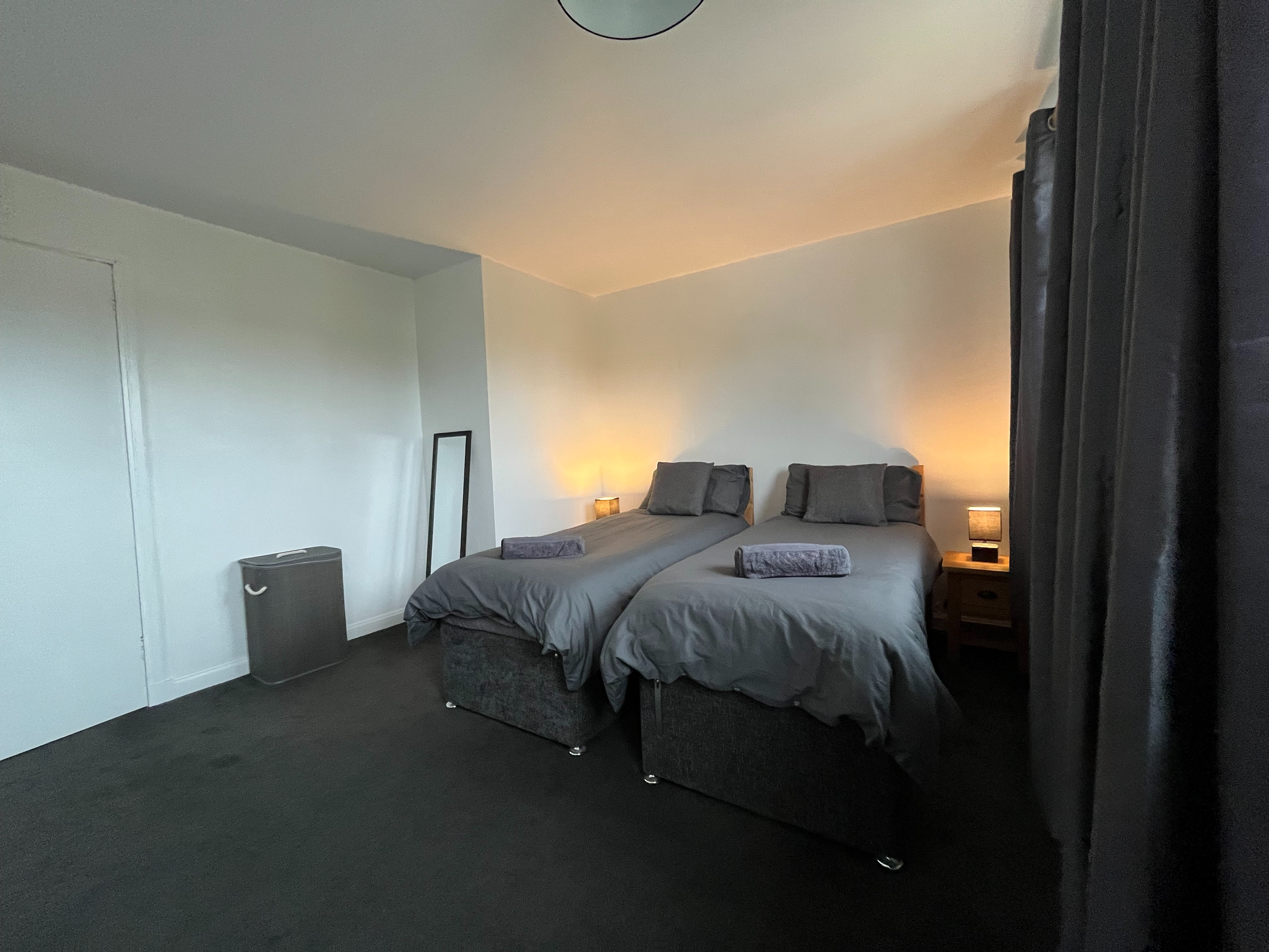 Main double bedroom in Inverness holiday home — king-size bed, natural light