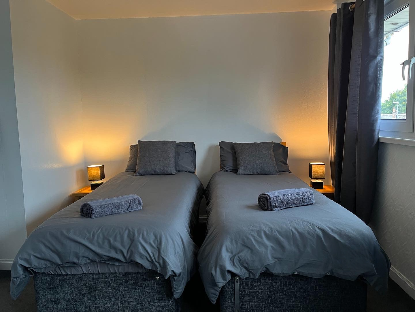 Second view of main bedroom in Inverness holiday home — wardrobe, window