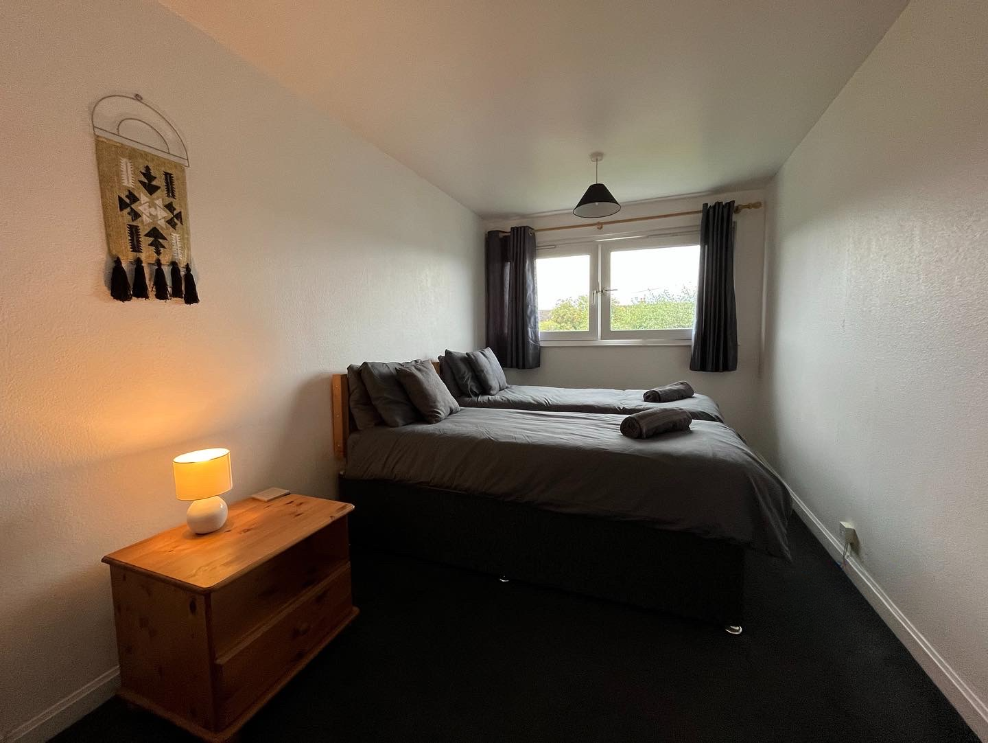 Twin bedroom in Inverness self-catering holiday home — two single beds, wardrobe